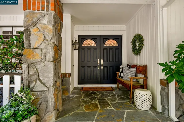 a front view of a house with outdoor seating