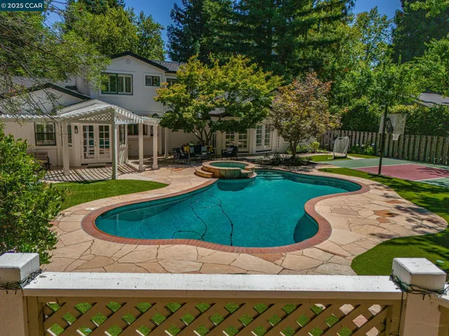 a view of a house with swimming pool