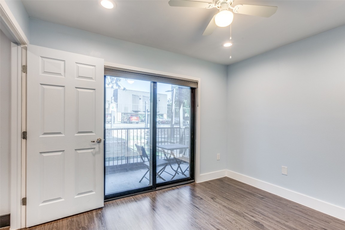 935 La Posada Drive, Unit 155 Austin, TX 78752 - Photo 17 of 25 Unfurnished room featuring wood finished floors and recessed lighting