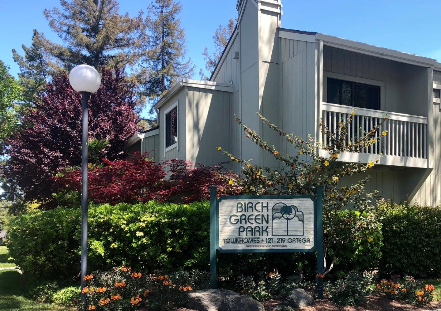 a sign that is on a brick wall