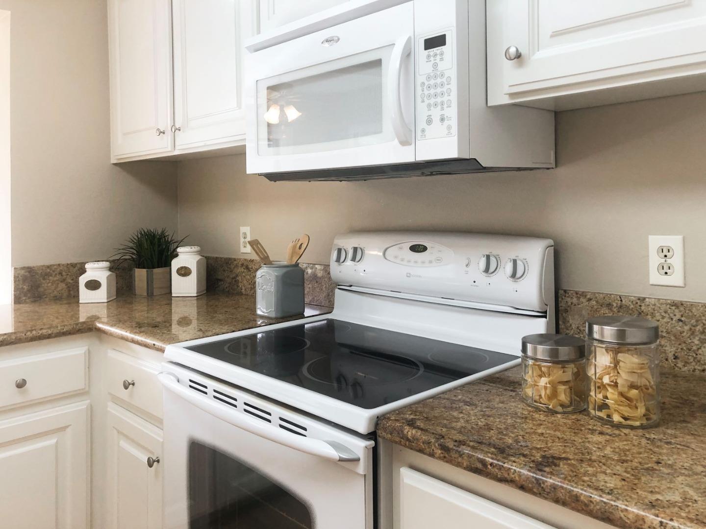 213 Ortega Avenue Mountain View, CA 94040 - Photo 13 of 37 a kitchen with a sink cabinets and appliances