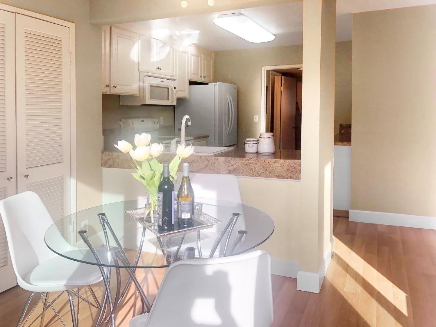 213 Ortega Avenue Mountain View, CA 94040 - Photo 14 of 37 a view of a dining room with furniture and wooden floor