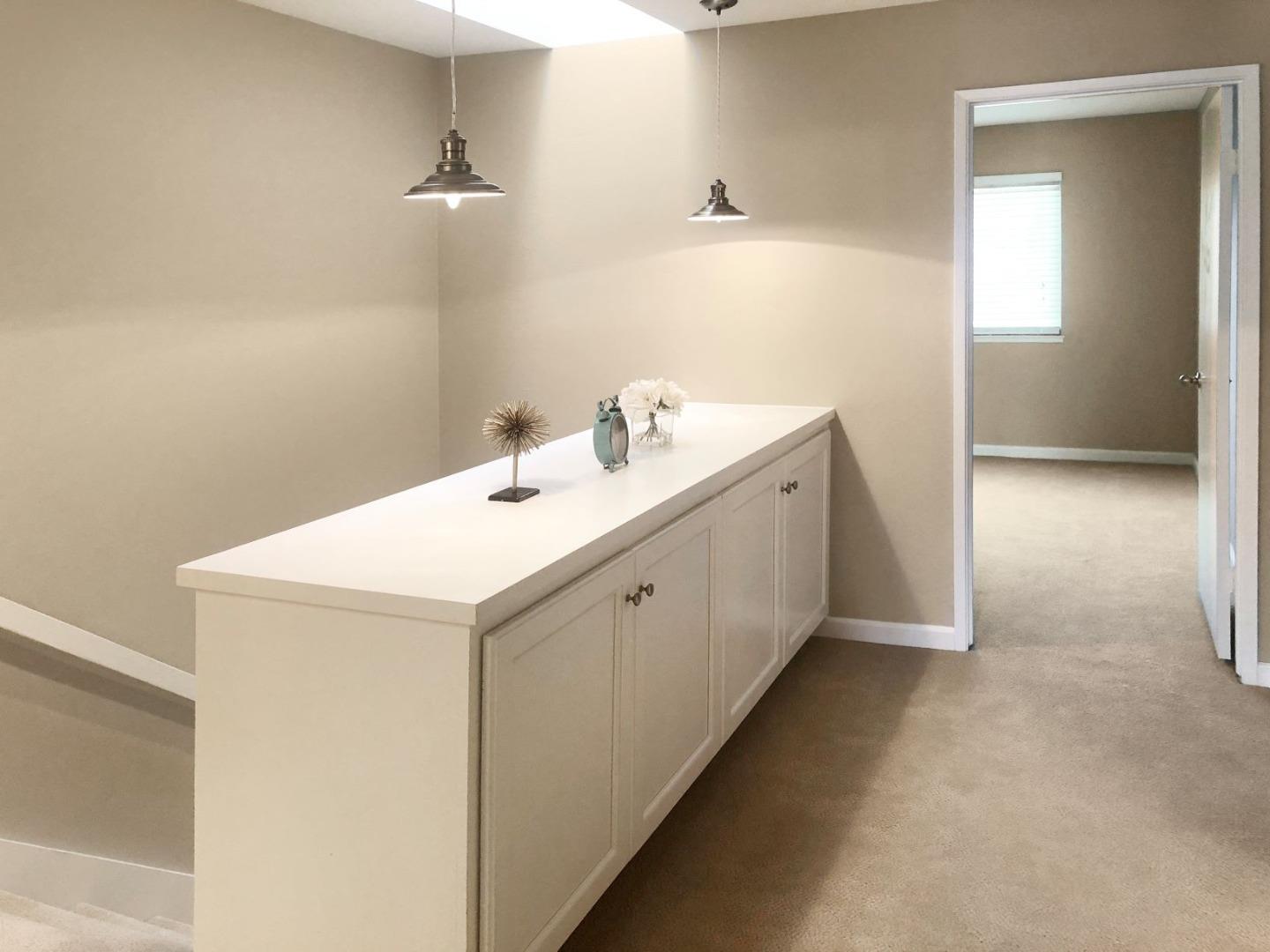 213 Ortega Avenue Mountain View, CA 94040 - Photo 18 of 37 a utility room with cabinets washer and dryer