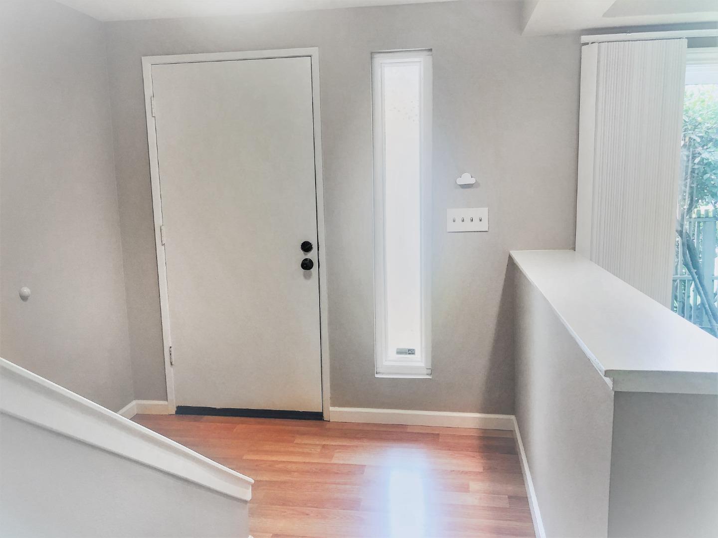 213 Ortega Avenue Mountain View, CA 94040 - Photo 5 of 37 a view of an empty room with wooden floor and a bathroom