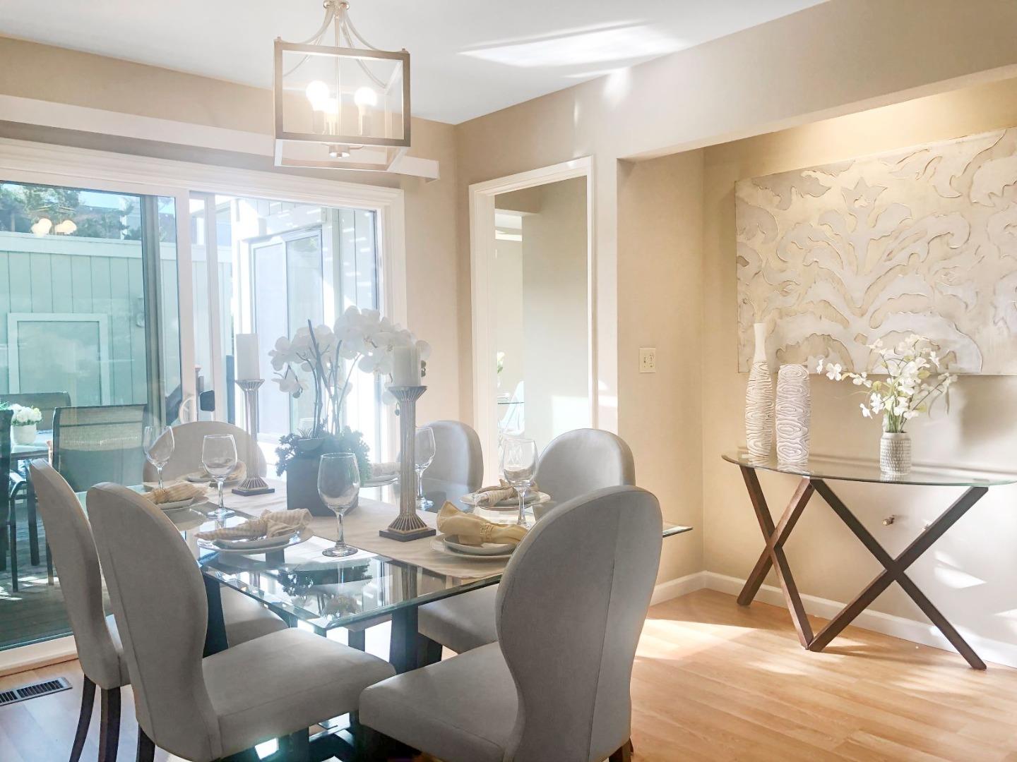 213 Ortega Avenue Mountain View, CA 94040 - Photo 8 of 37 a dining room with furniture a chandelier and wooden floor