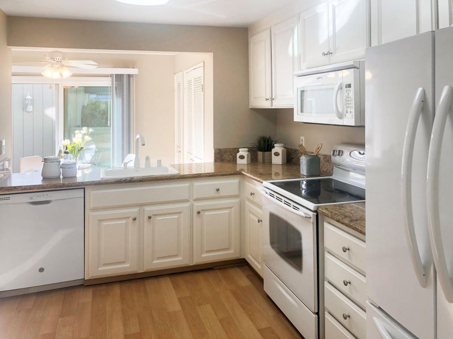 213 Ortega Avenue Mountain View, CA 94040 - Photo 10 of 37 a kitchen with white cabinets white appliances and sink