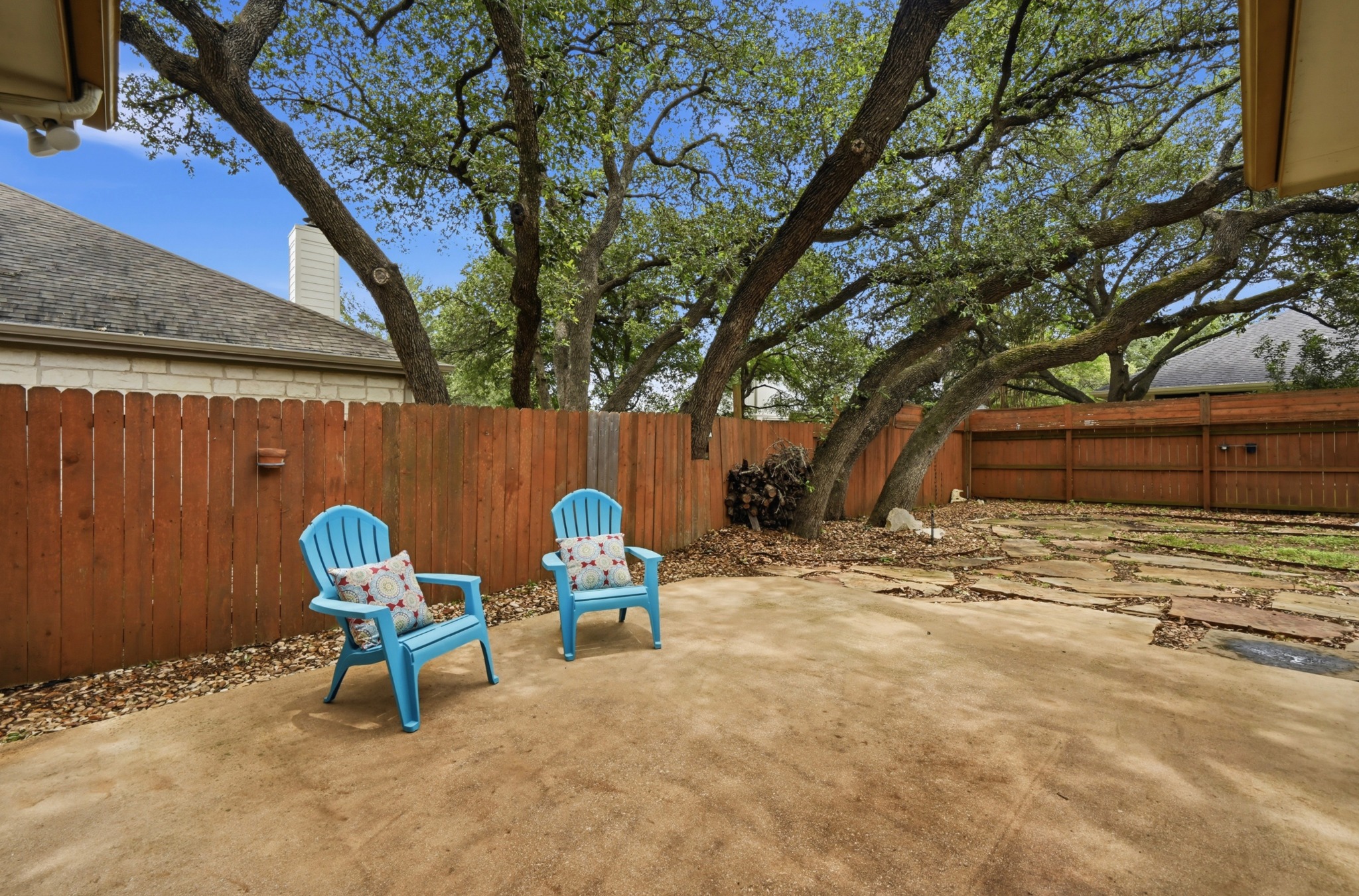 5313 Moon Shadow Drive Austin, TX 78735 - Photo 26 of 30 Expansive concrete patio area with a wooden privacy fence