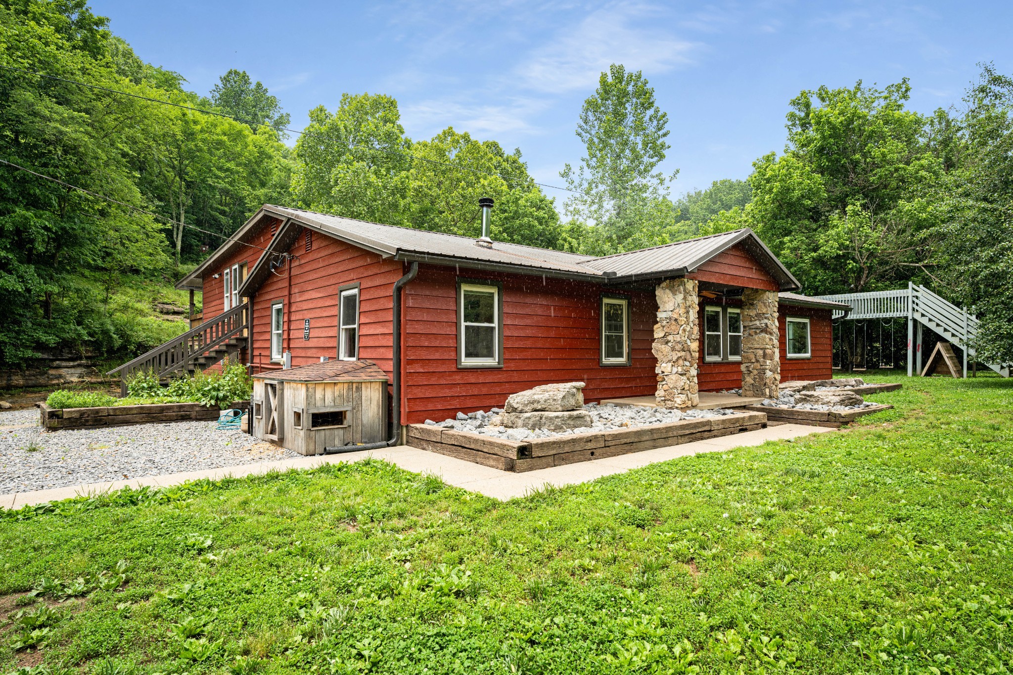 715 Rogues Fork Road Bethpage, TN 37022 - Photo 1 of 68 a front view of a house with a yard table and chairs