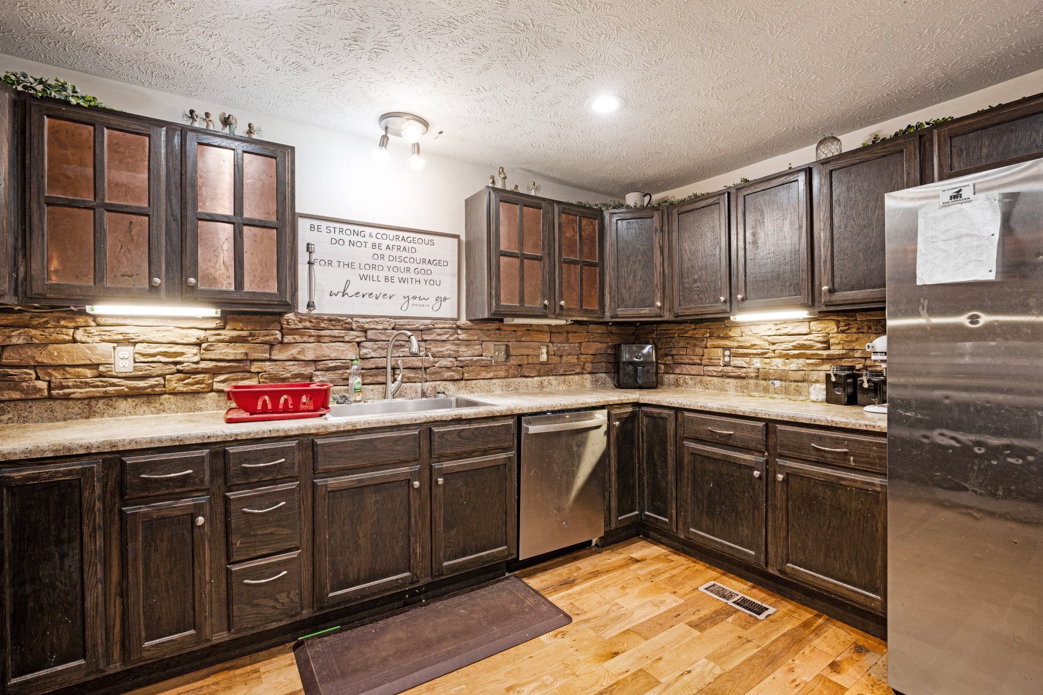 715 Rogues Fork Road Bethpage, TN 37022 - Photo 11 of 68 a kitchen with stainless steel appliances granite countertop a sink stove and cabinets