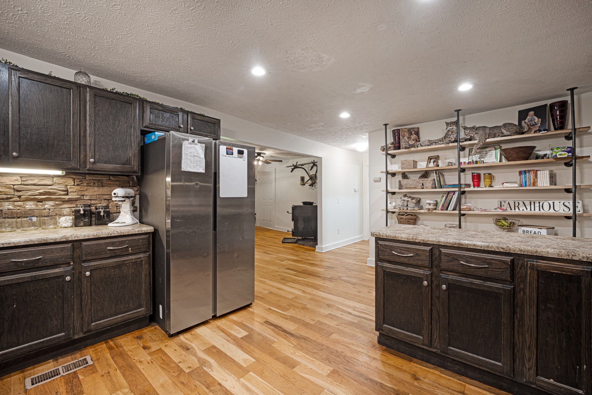 715 Rogues Fork Road Bethpage, TN 37022 - Photo 12 of 68 a kitchen with stainless steel appliances granite countertop a refrigerator and a sink