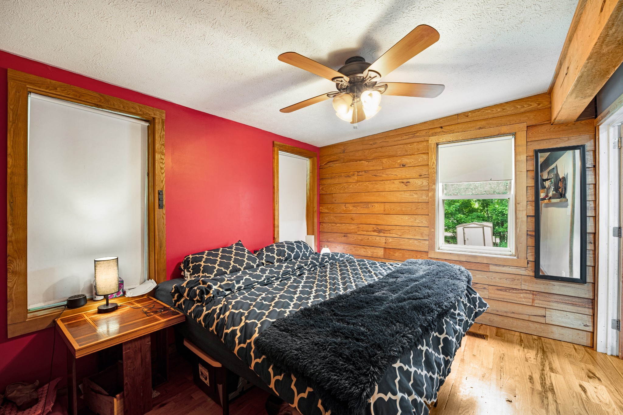 715 Rogues Fork Road Bethpage, TN 37022 - Photo 17 of 68 a bedroom with a bed and a chandelier