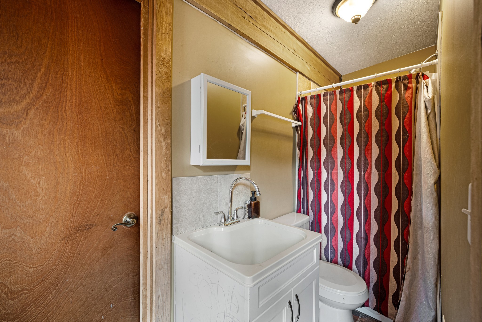 715 Rogues Fork Road Bethpage, TN 37022 - Photo 20 of 68 a bathroom with a sink toilet and shower