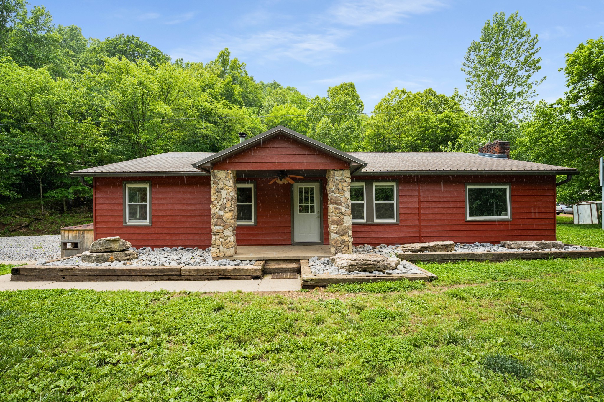715 Rogues Fork Road Bethpage, TN 37022 - Photo 3 of 68 a front view of house with yard and trees in the background