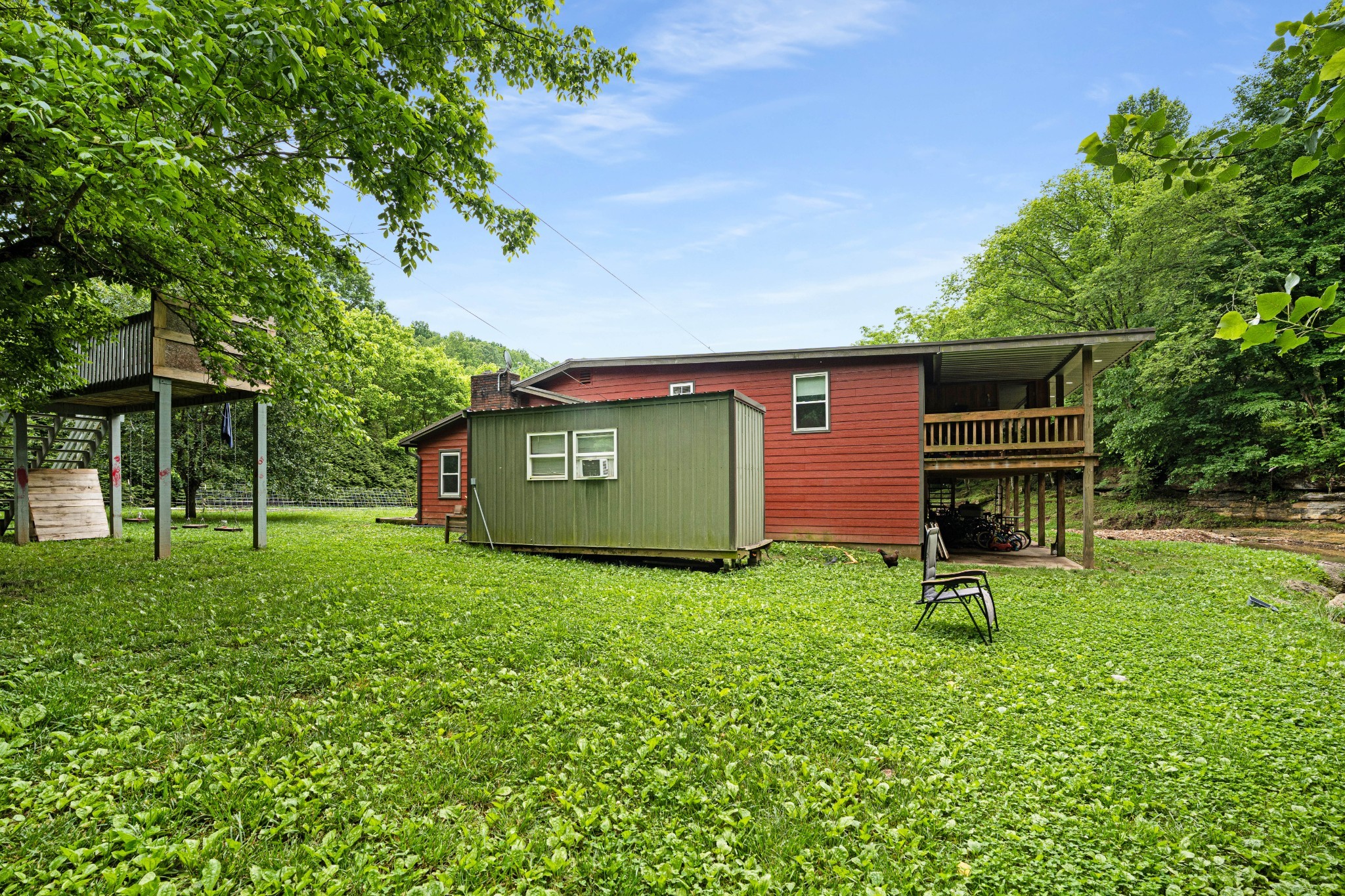 715 Rogues Fork Road Bethpage, TN 37022 - Photo 32 of 68 a view of a backyard with a garden
