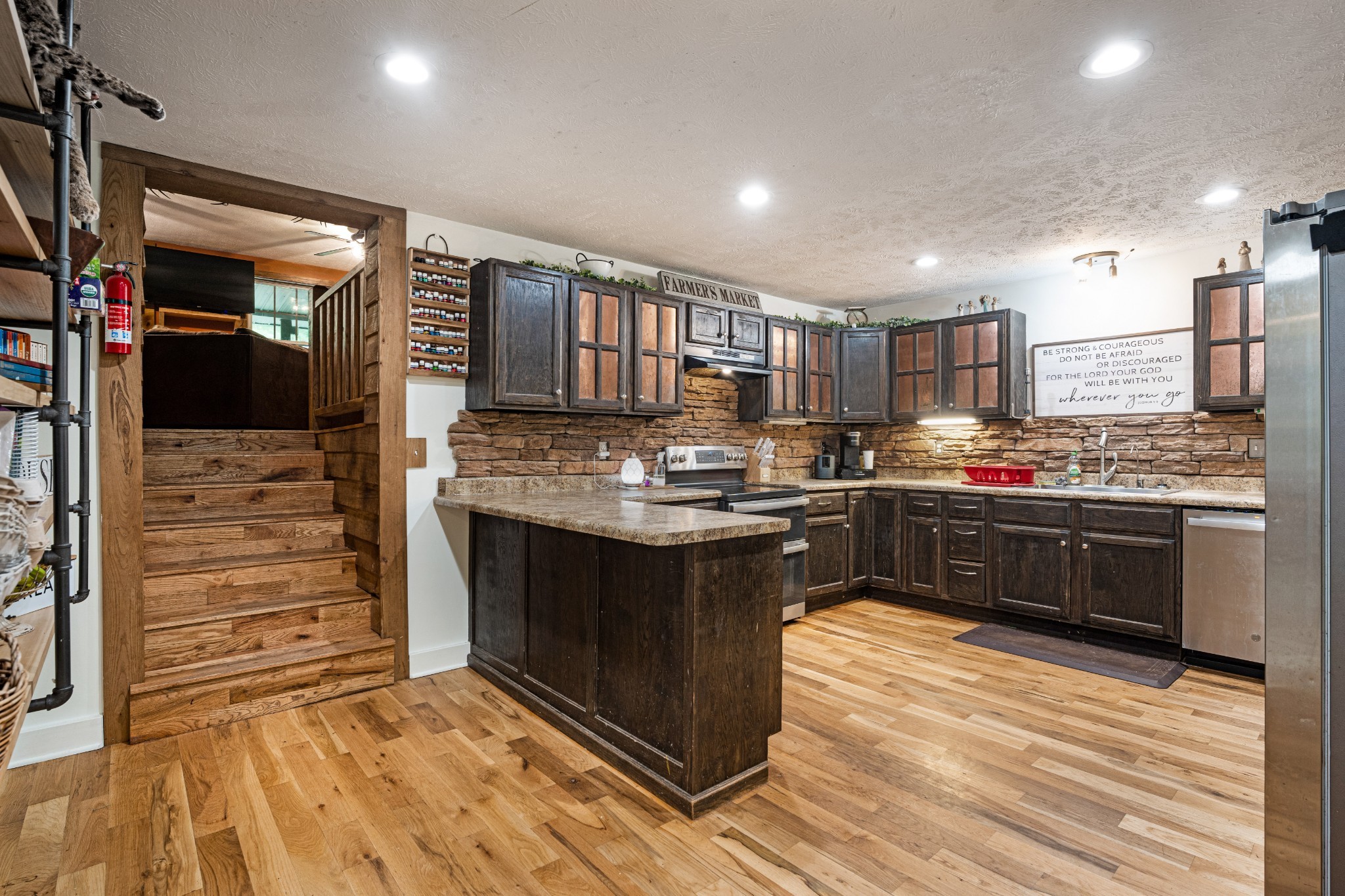 715 Rogues Fork Road Bethpage, TN 37022 - Photo 7 of 68 a kitchen with kitchen island granite countertop a sink cabinets and stainless steel appliances