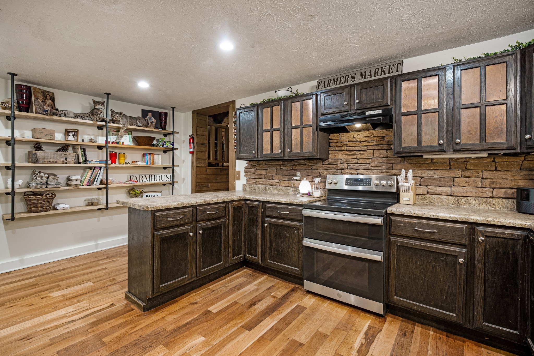 715 Rogues Fork Road Bethpage, TN 37022 - Photo 8 of 68 a kitchen with stainless steel appliances granite countertop a stove and a sink