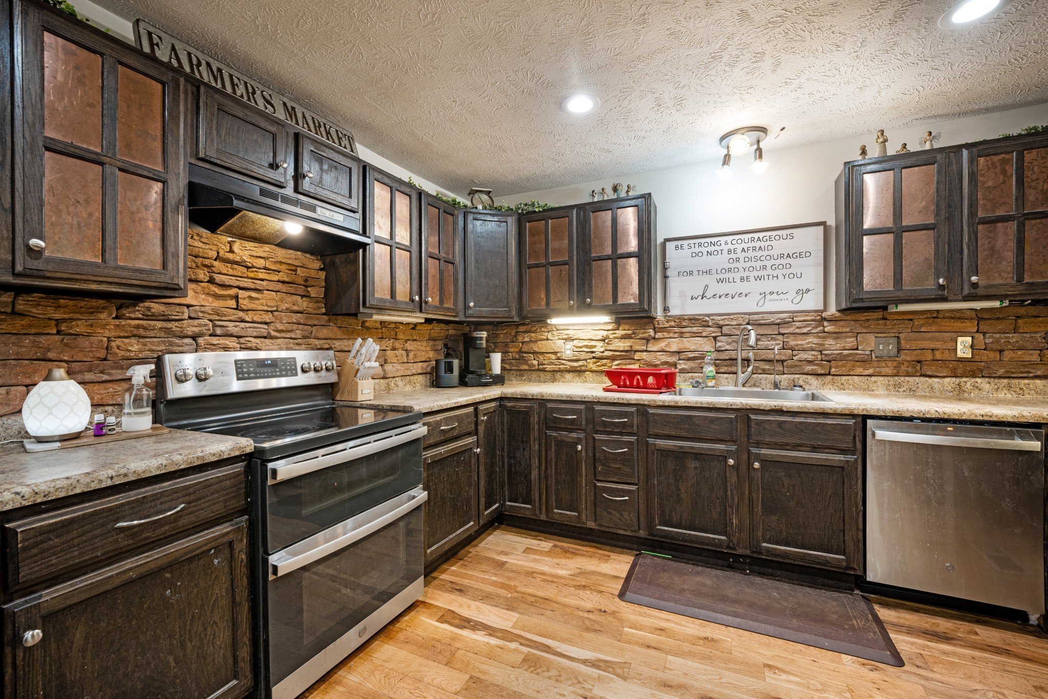 715 Rogues Fork Road Bethpage, TN 37022 - Photo 9 of 68 a kitchen with stainless steel appliances granite countertop counter space a sink and cabinets