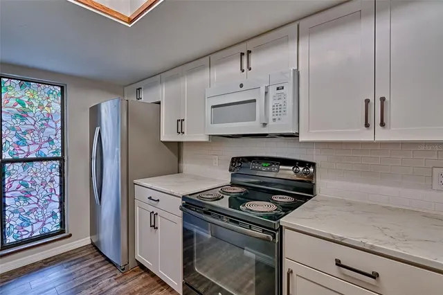 a kitchen with a stove and a sink