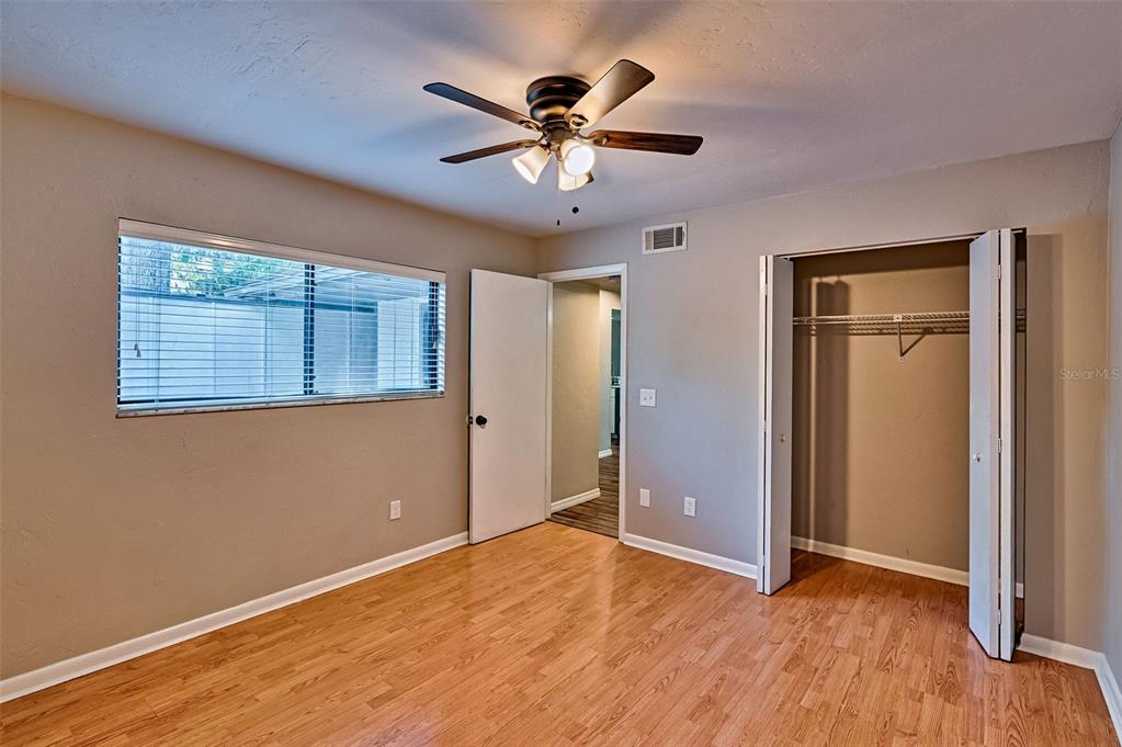 5422 Southwest 4th Place Gainesville, FL 32607 - Photo 16 of 29 a view of an empty room with wooden floor and a window