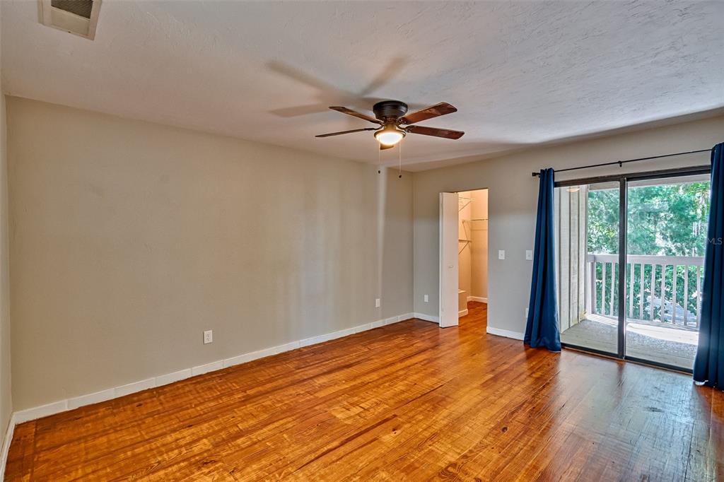 5422 Southwest 4th Place Gainesville, FL 32607 - Photo 18 of 29 wooden floor in an empty room with a window