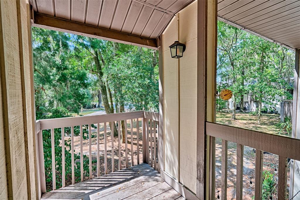5422 Southwest 4th Place Gainesville, FL 32607 - Photo 21 of 29 a view of a porch with a yard