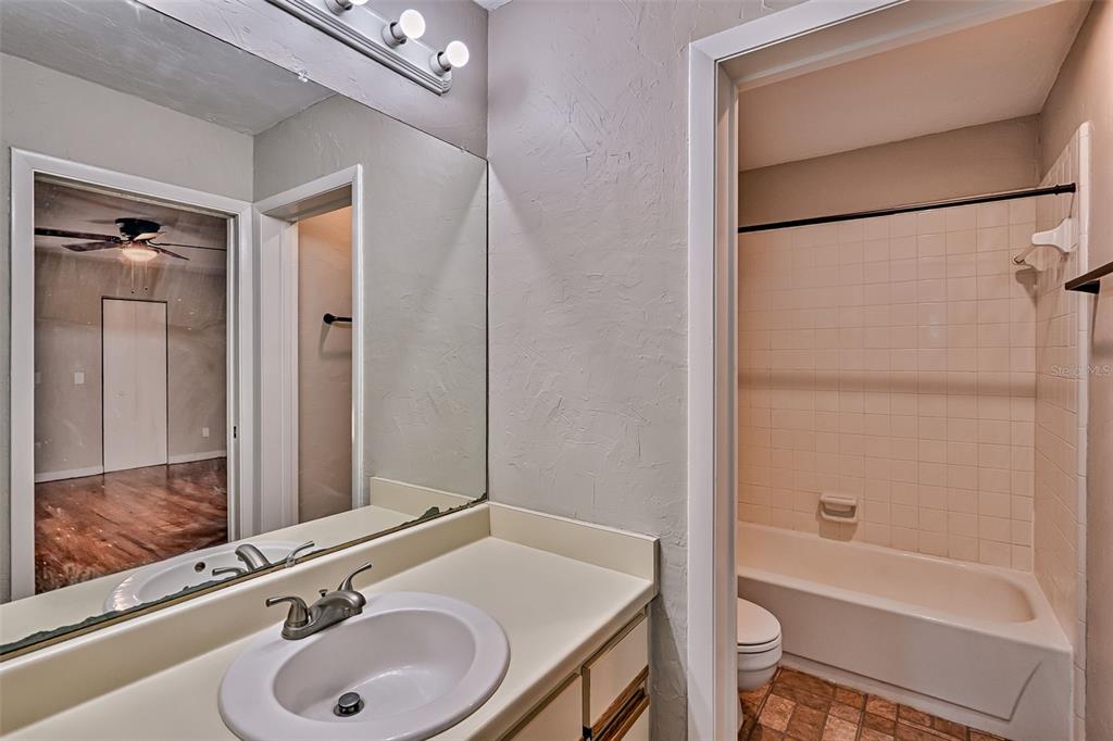 5422 Southwest 4th Place Gainesville, FL 32607 - Photo 22 of 29 a bathroom with a sink and a mirror