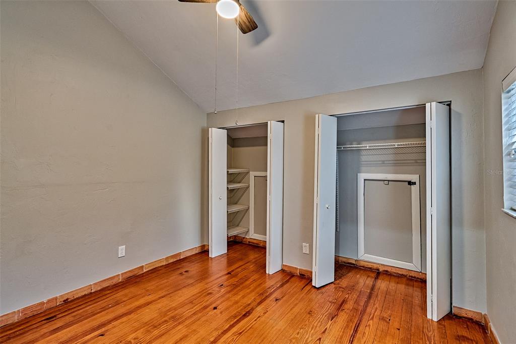 5422 Southwest 4th Place Gainesville, FL 32607 - Photo 23 of 29 an empty room with closet and wooden floor