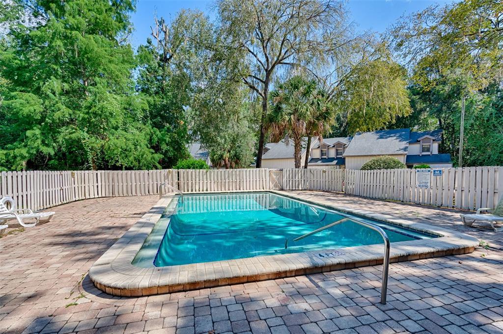 5422 Southwest 4th Place Gainesville, FL 32607 - Photo 27 of 29 a view of a backyard with wooden fence