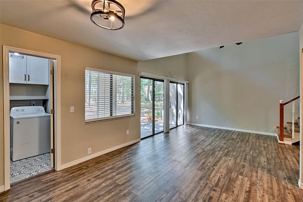 5422 Southwest 4th Place Gainesville, FL 32607 - Photo 7 of 29 a view of empty room with wooden floor and fan