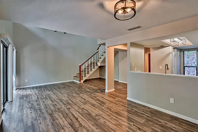 a view of an entryway with wooden floor