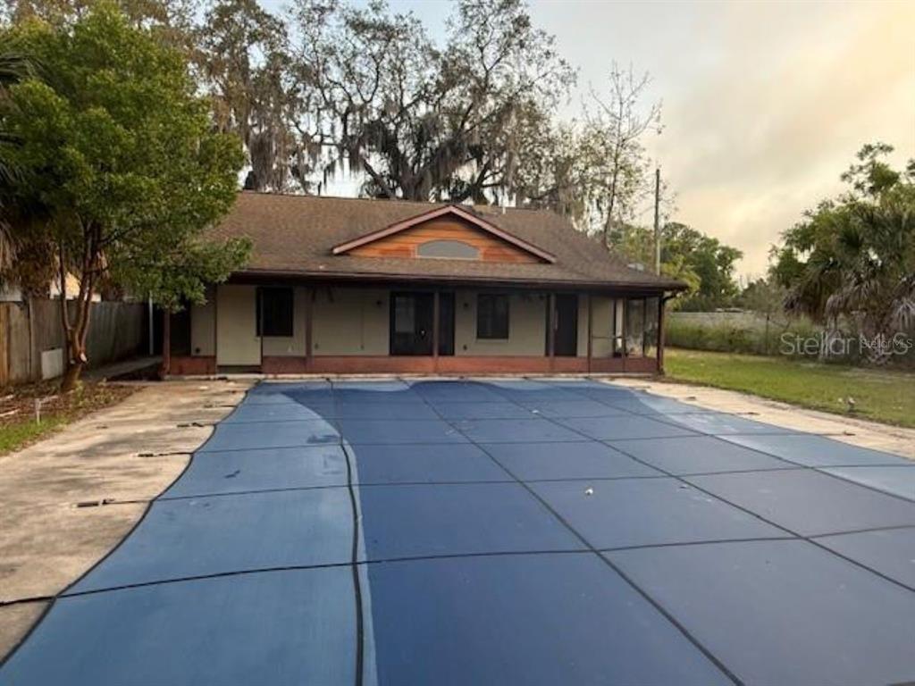 701 Madison Street Tavares, FL 32778 - Photo 12 of 12 a front view of a house with garden