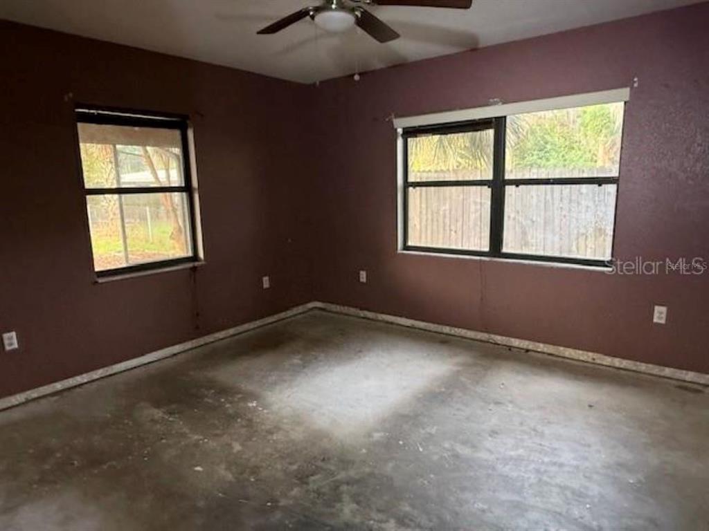 701 Madison Street Tavares, FL 32778 - Photo 6 of 12 an empty room with a window