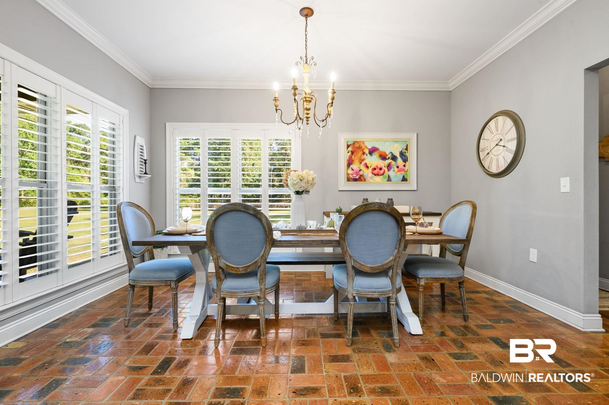 52579 Stockton Cemetery Road Stockton, AL 36507 - Photo 13 of 66 Dining room featuring brick floors, crown molding, and a chandelier