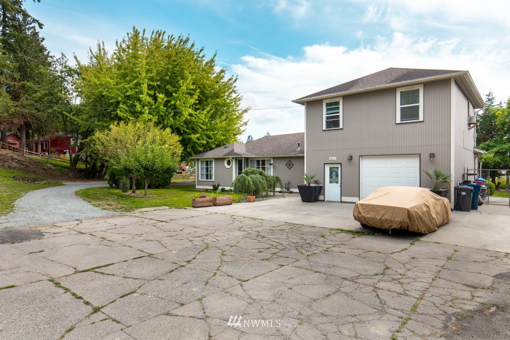 16722 Blodgett Road Mount Vernon, WA 98274 - Photo 2 of 37 a view of a house with a patio and yard