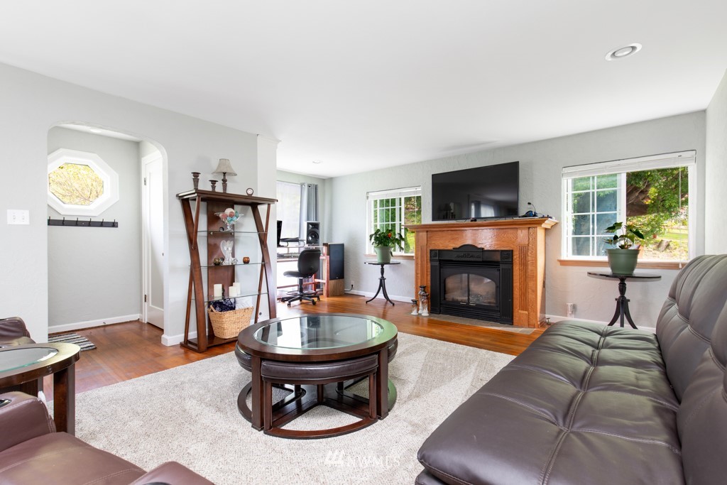 16722 Blodgett Road Mount Vernon, WA 98274 - Photo 16 of 37 a living room with furniture a fireplace and a flat screen tv