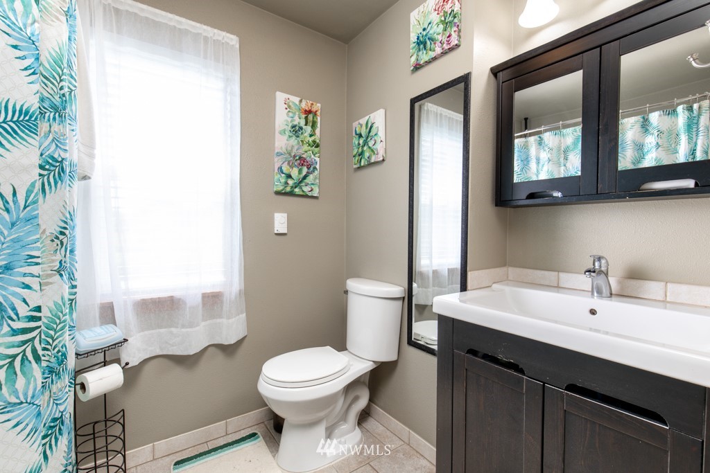 16722 Blodgett Road Mount Vernon, WA 98274 - Photo 21 of 37 a bathroom with a sink and a mirror
