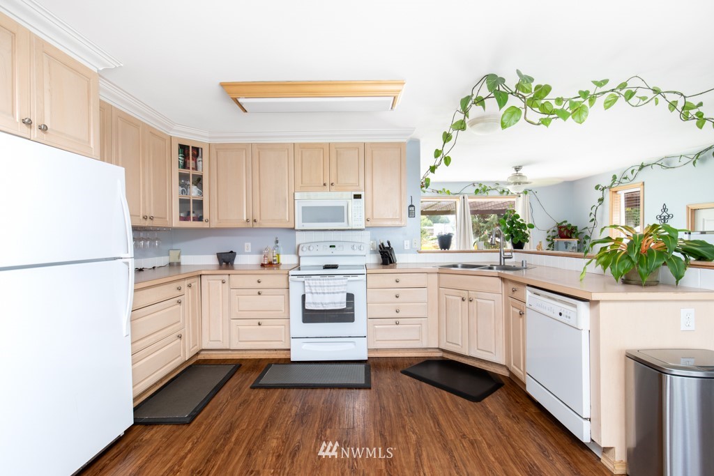 16722 Blodgett Road Mount Vernon, WA 98274 - Photo 24 of 37 a kitchen with white cabinets and white appliances