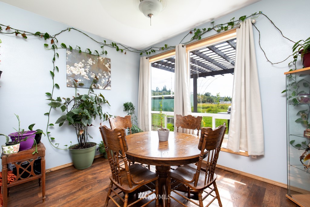 16722 Blodgett Road Mount Vernon, WA 98274 - Photo 26 of 37 a view of a dining room with furniture window and wooden floor