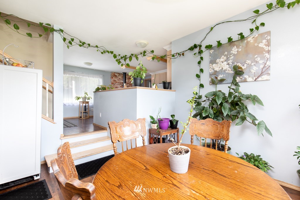 16722 Blodgett Road Mount Vernon, WA 98274 - Photo 27 of 37 a view of a dining room with furniture and a chandelier