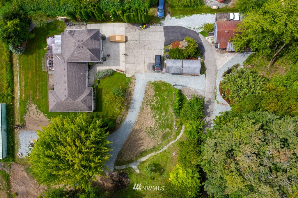 16722 Blodgett Road Mount Vernon, WA 98274 - Photo 33 of 37 an aerial view of a house with a yard and a large pool