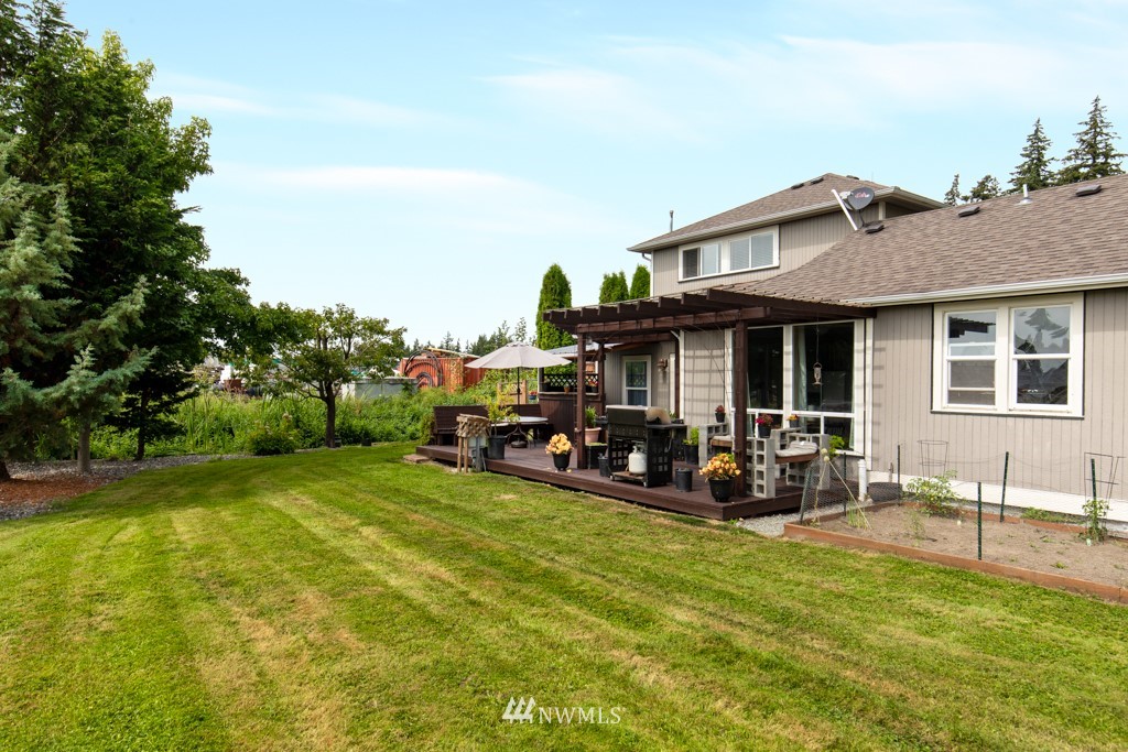 16722 Blodgett Road Mount Vernon, WA 98274 - Photo 7 of 37 a view of a house with sitting area and garden