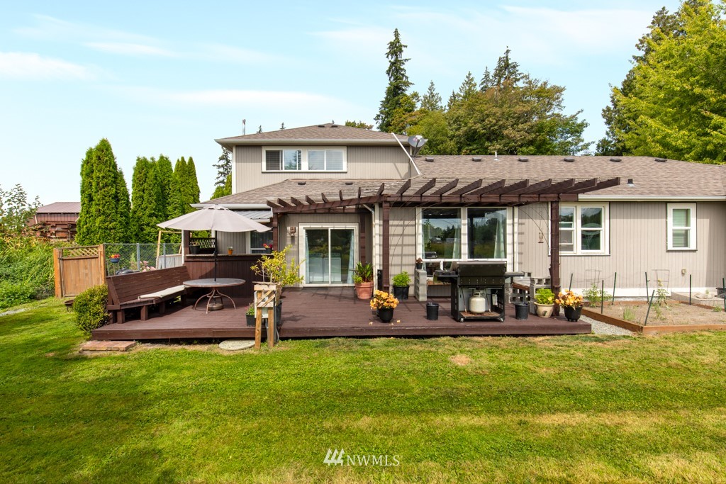 16722 Blodgett Road Mount Vernon, WA 98274 - Photo 8 of 37 a view of a house with a backyard patio and swimming pool