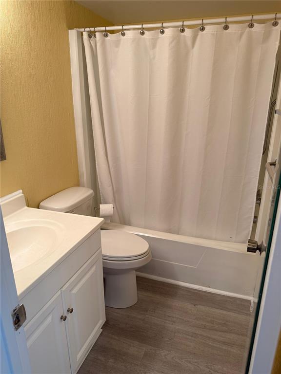 2207 Belleair Road, Unit B22 Clearwater, FL 33764 - Photo 8 of 17 a bathroom with a sink a toilet and a shower