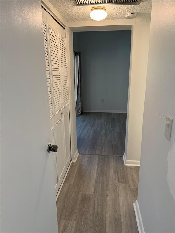 2207 Belleair Road, Unit B22 Clearwater, FL 33764 - Photo 9 of 17 a view of a room with wooden floor and a window