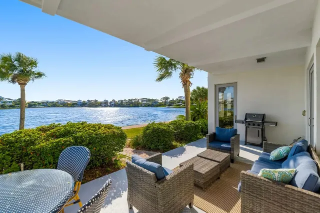a balcony with couch and outdoor view