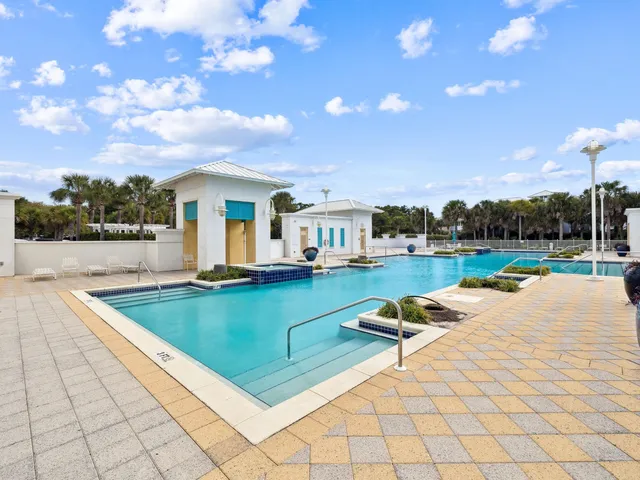 a view of swimming pool with seating space