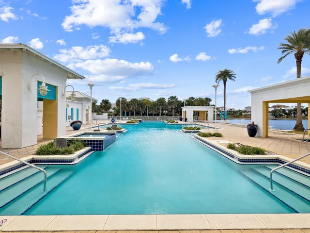 a view of a swimming pool with lounge chairs