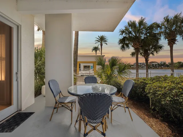 a view of a balcony with furniture and a potted plant