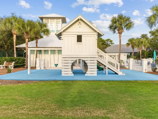 a view of house with outdoor space and swimming pool