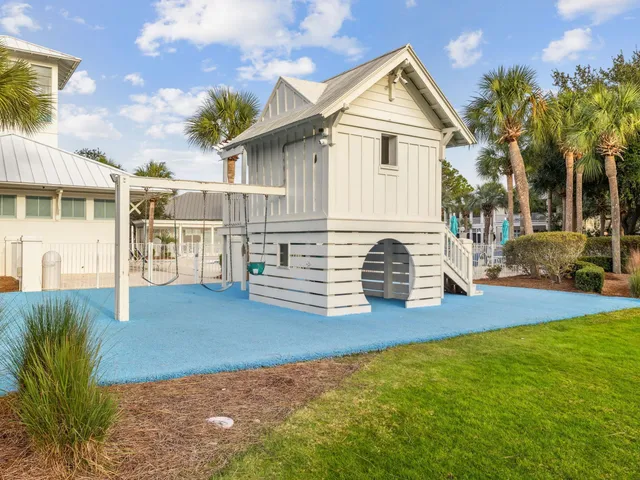 a view of house with yard and green space